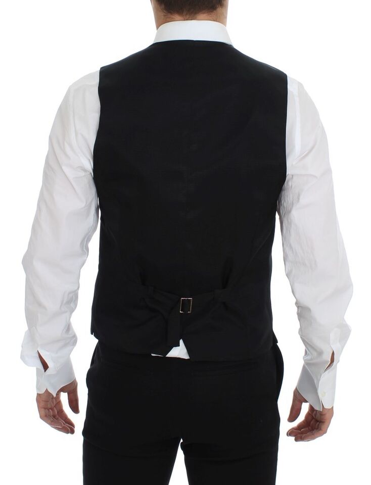 A gray wool vest with a black satin lapel and belt loops