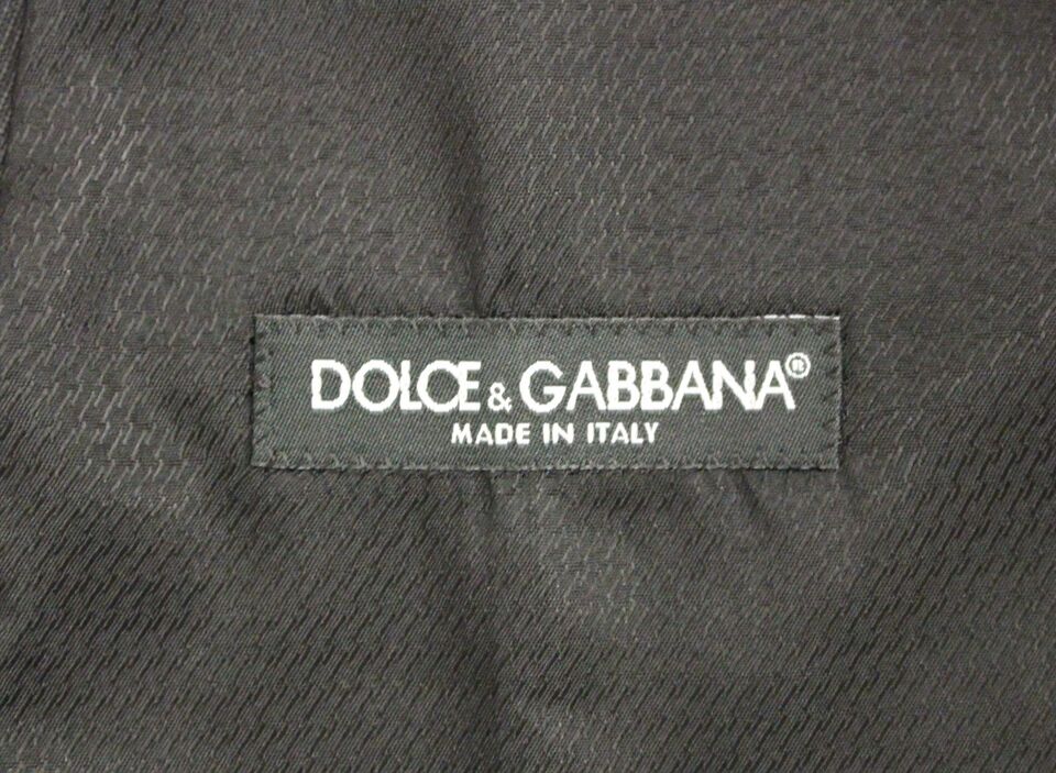 A gray wool vest from Dolce & Gabbana, featuring the brand's logo