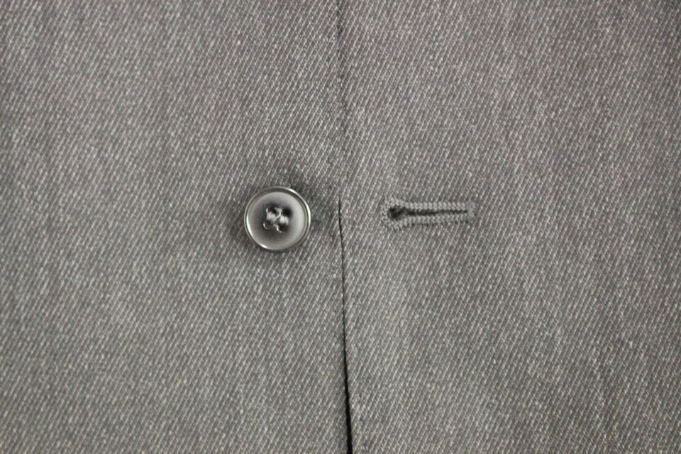 A gray wool vest with a button closure