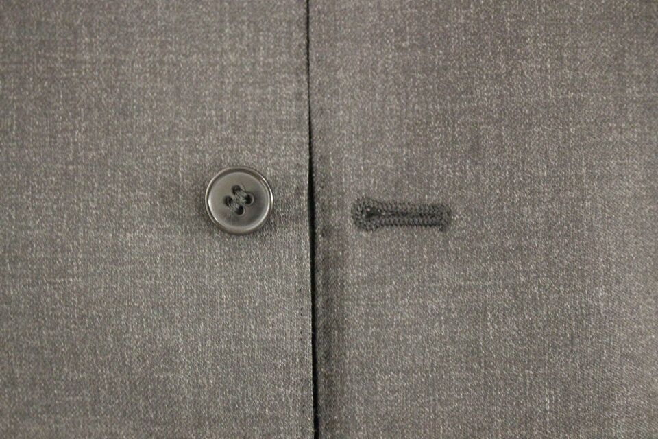 A gray wool vest from Dolce & Gabbana, part of a formal dress ensemble