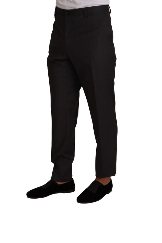Man wearing black suit pants and shoes