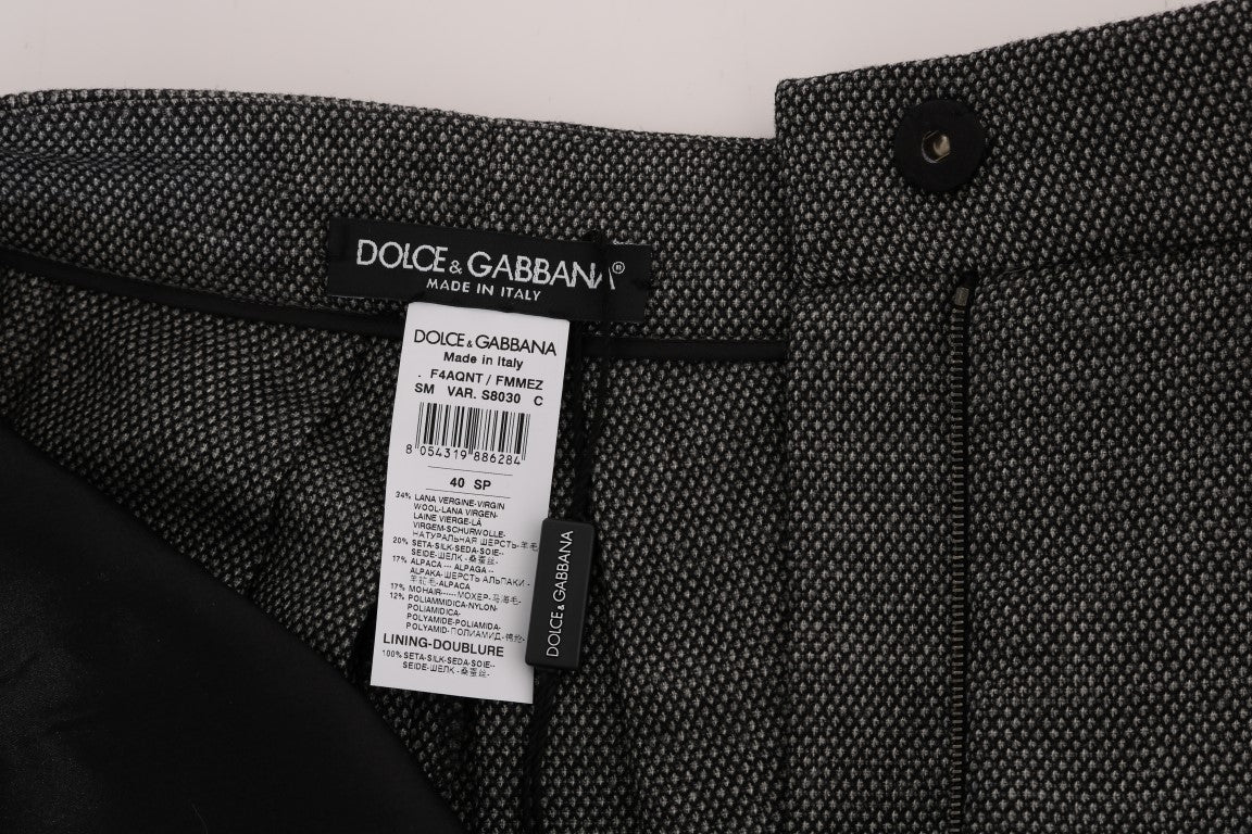 Pair of black trousers with a label on them