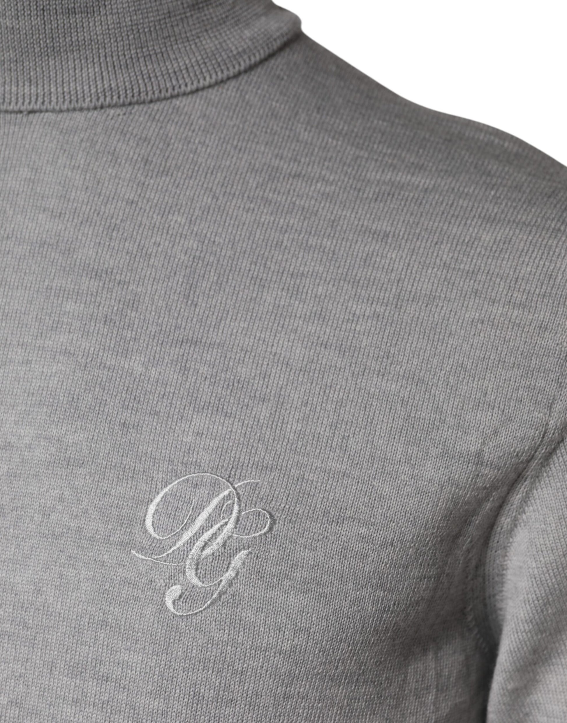 Grey turtleneck sweater with embroidered initials on chest