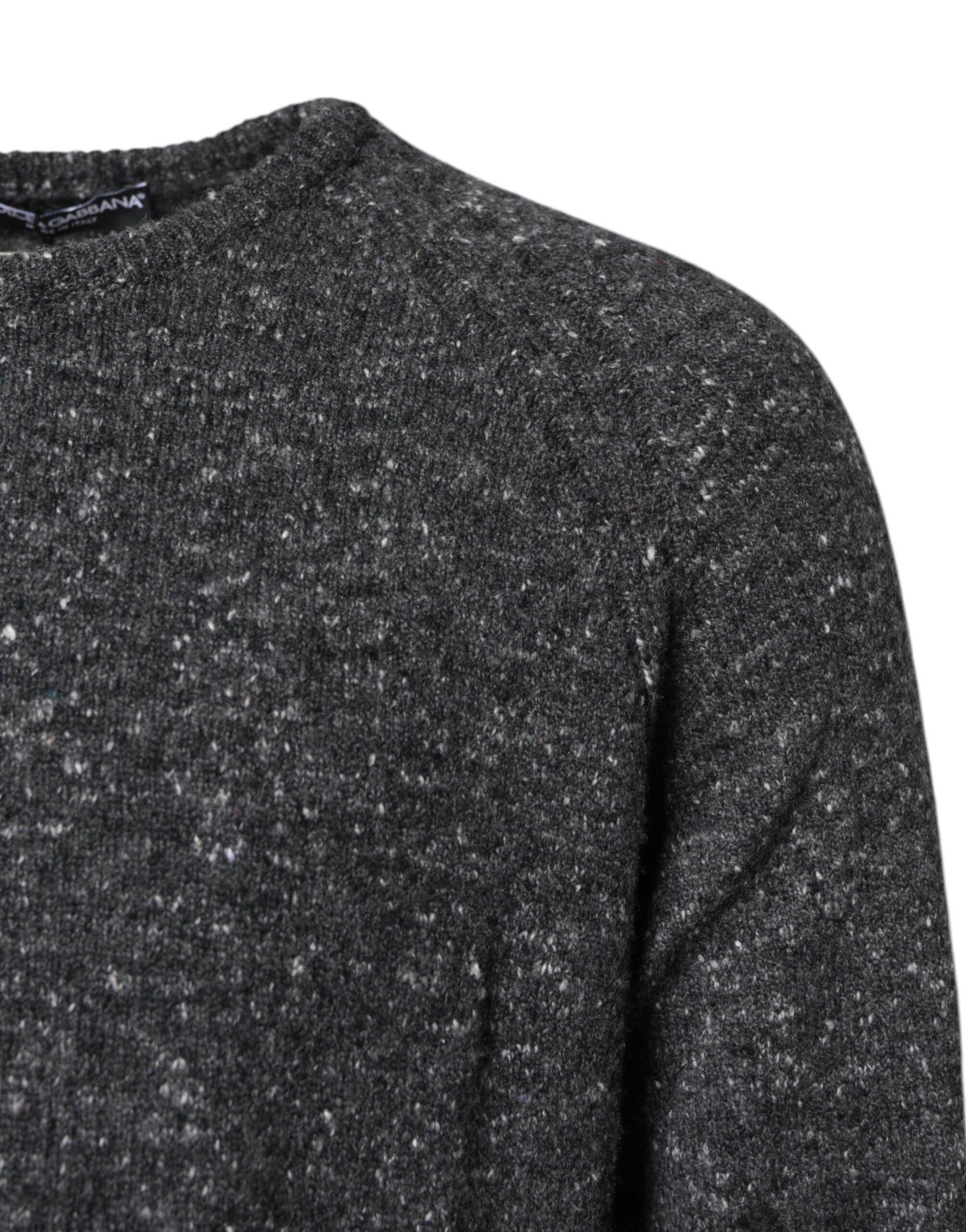 A dark gray sweater with a speckled texture