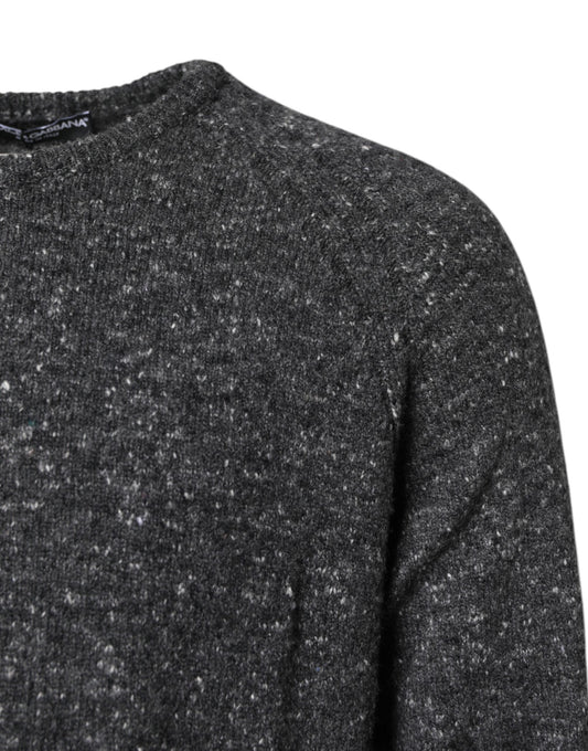 A dark gray sweater with a speckled texture