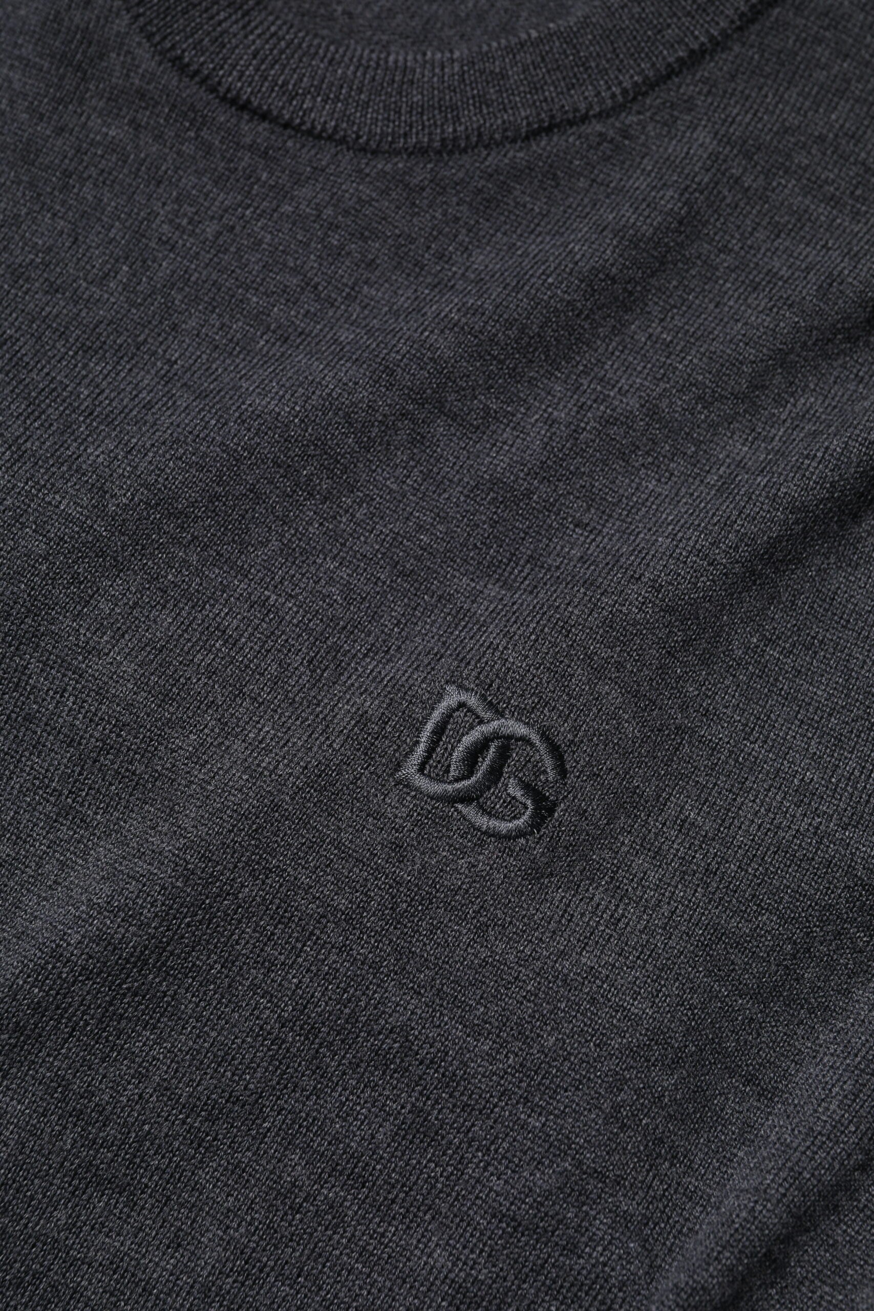 Black heathered crew neck t-shirt with embroidered logo on left chest area
