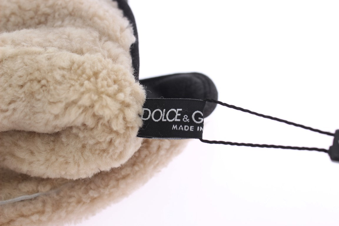 Fuzzy brown slipper with black tag reading "dolce & gabbana made in italy"