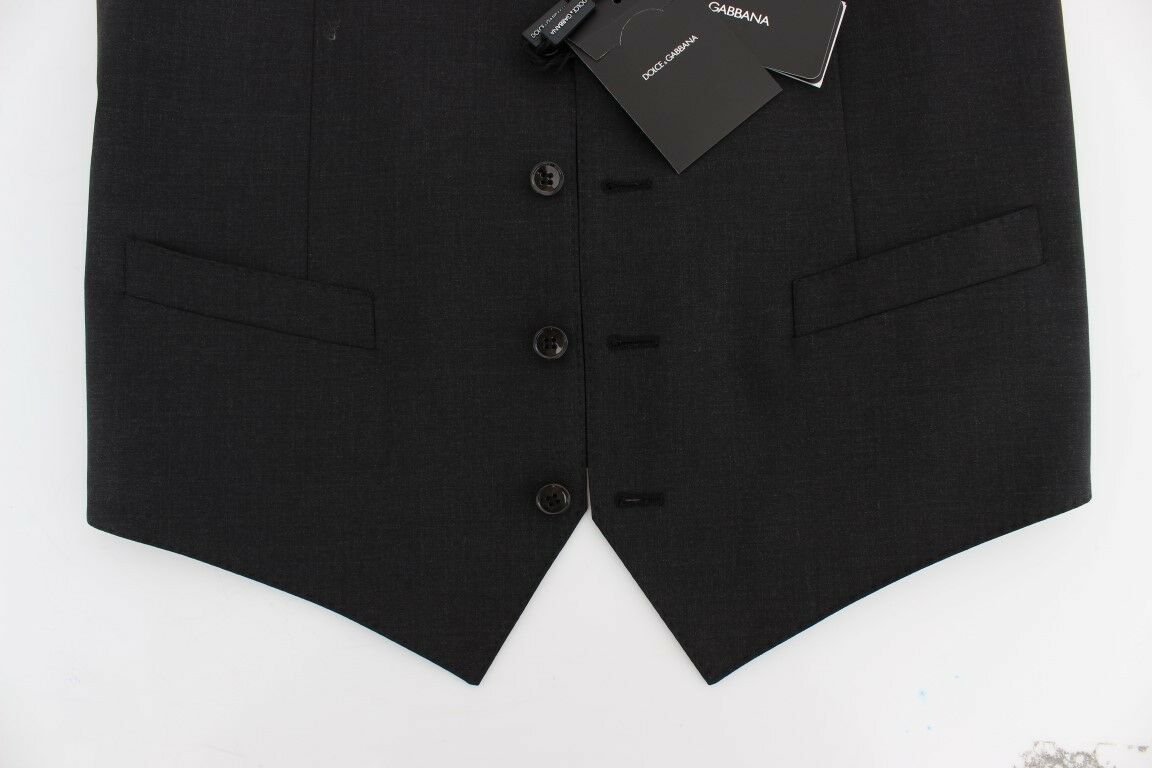 A gray wool blazer with black buttons and a tag attached to the front