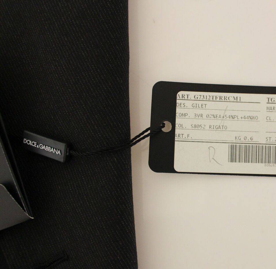A gray wool vest with a tag attached to it, indicating it is from the brand Dolce & Gabbana