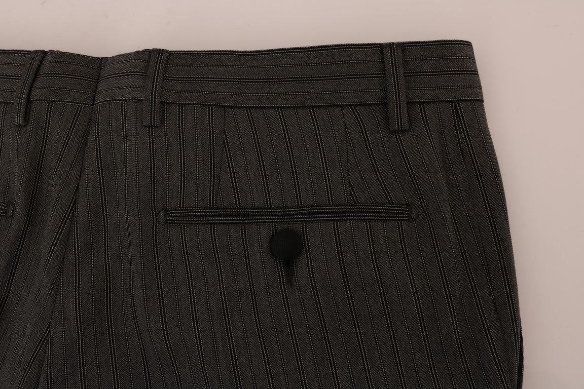 Pair of black pants with a hole in the knee