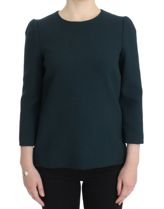 Woman wearing dark blazer with ruffled sleeves