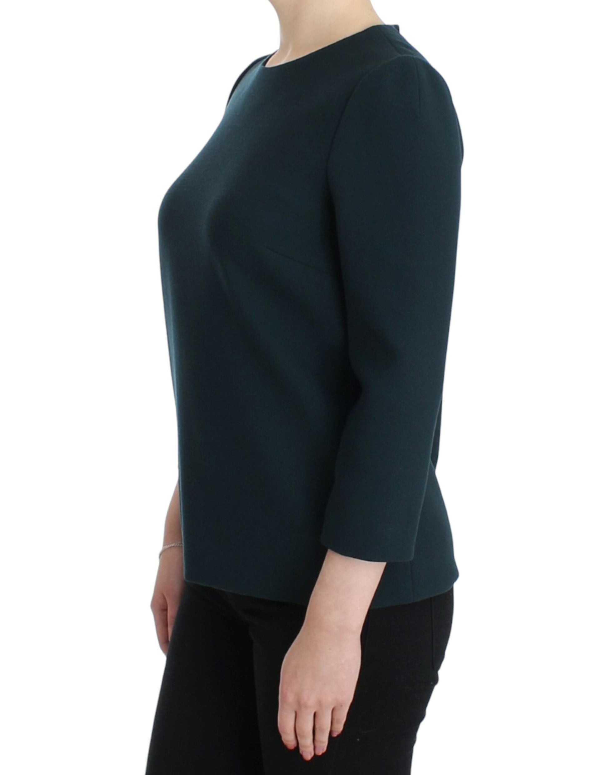 Woman wearing dark green long sleeve top