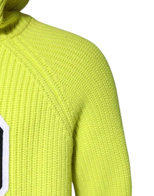 Yellow knit sweater with ribbed cuffs and hem