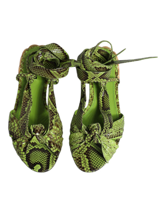 Pair of green snake print high heels