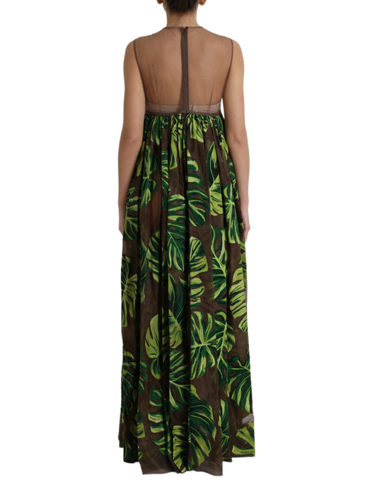 A long sleeveless maxi dress with a green banana leaf print