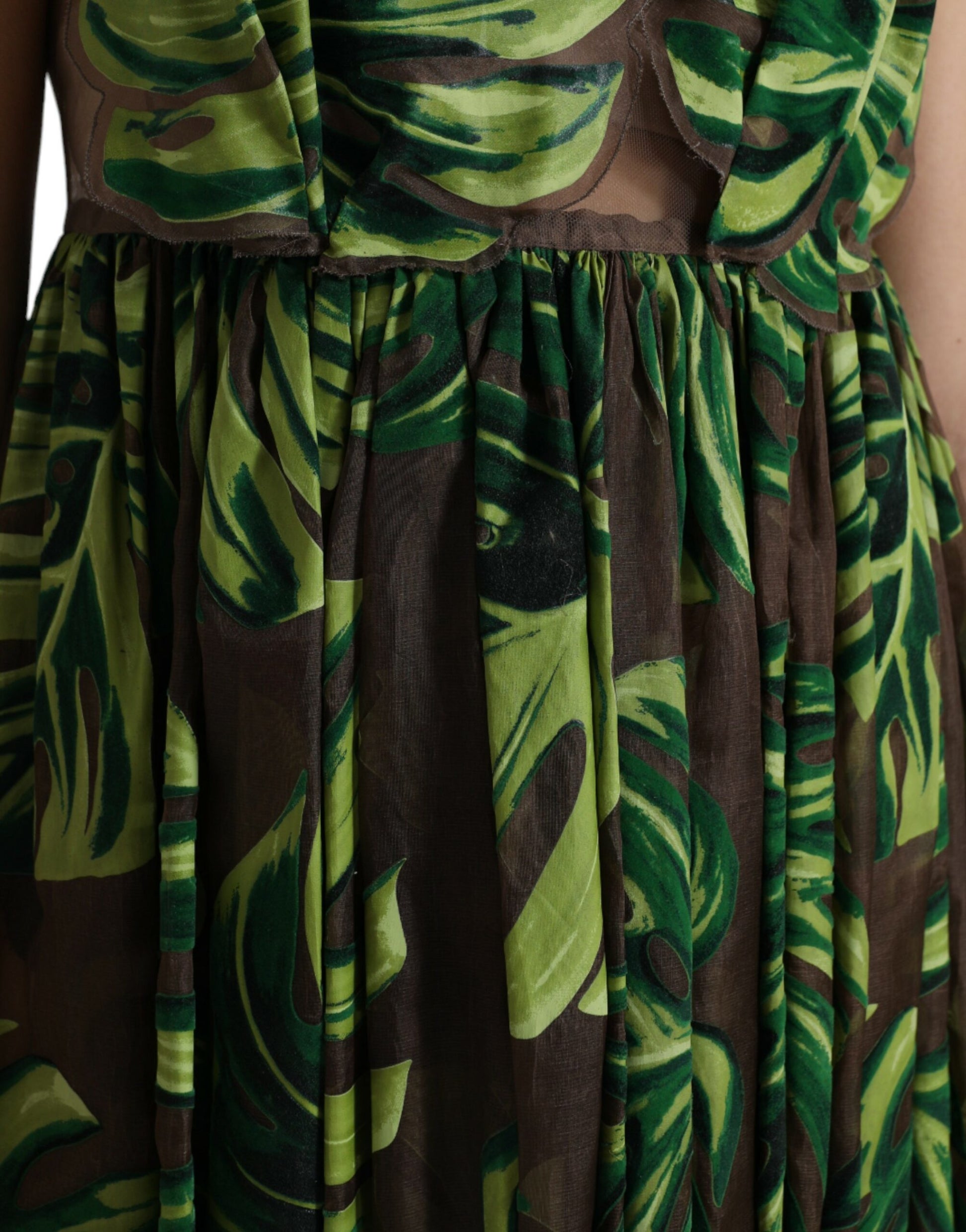 A sleeveless, long maxi dress with a banana leaf print