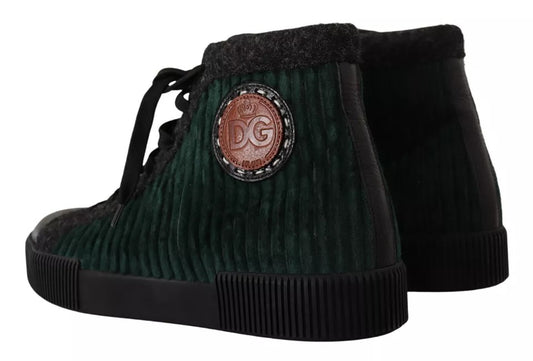Pair of black velvet sneakers with a red logo on the side and a white sole