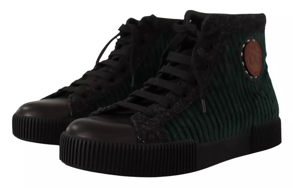 Pair of black and green high top sneakers with lace closure