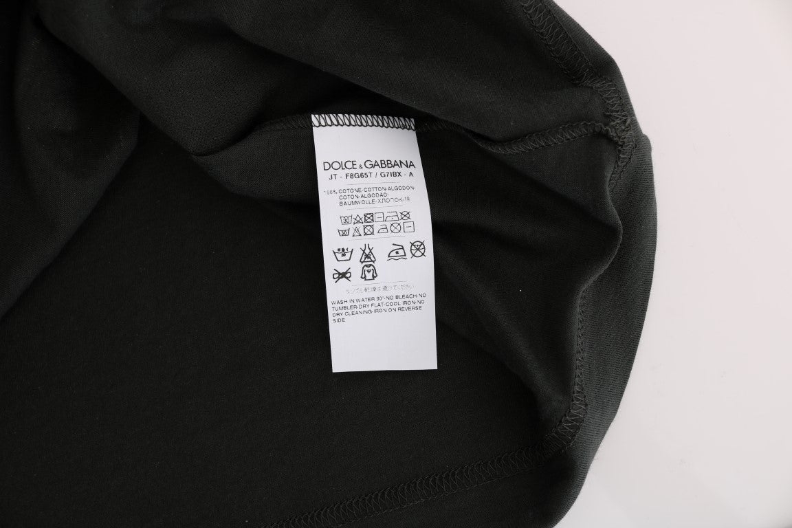 Black clothing item with white tag attached to neckline