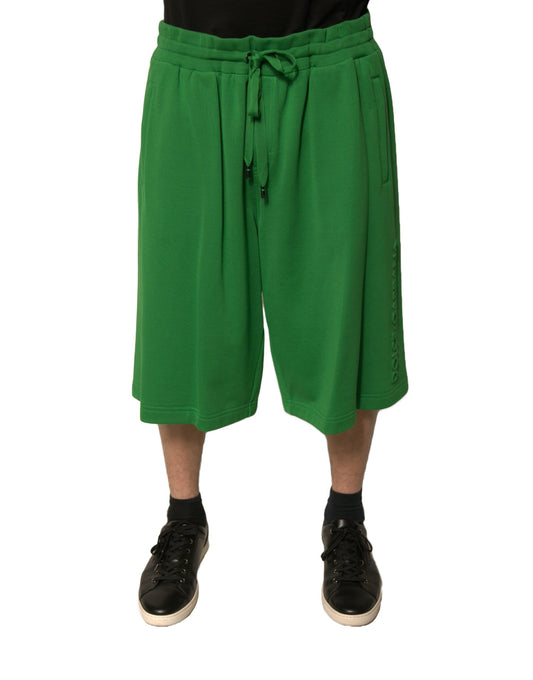 A pair of green cotton blend men's bermuda shorts with drawstring waist