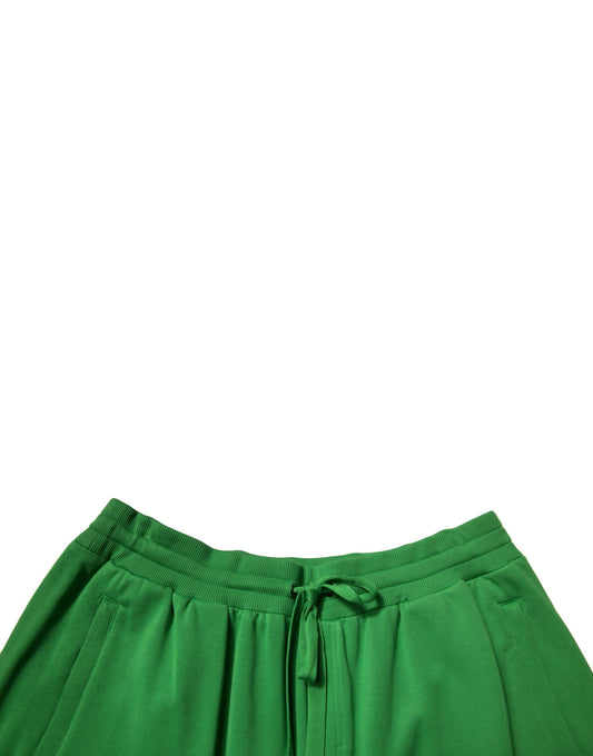 A pair of green cotton blend men's bermuda shorts with a drawstring waist