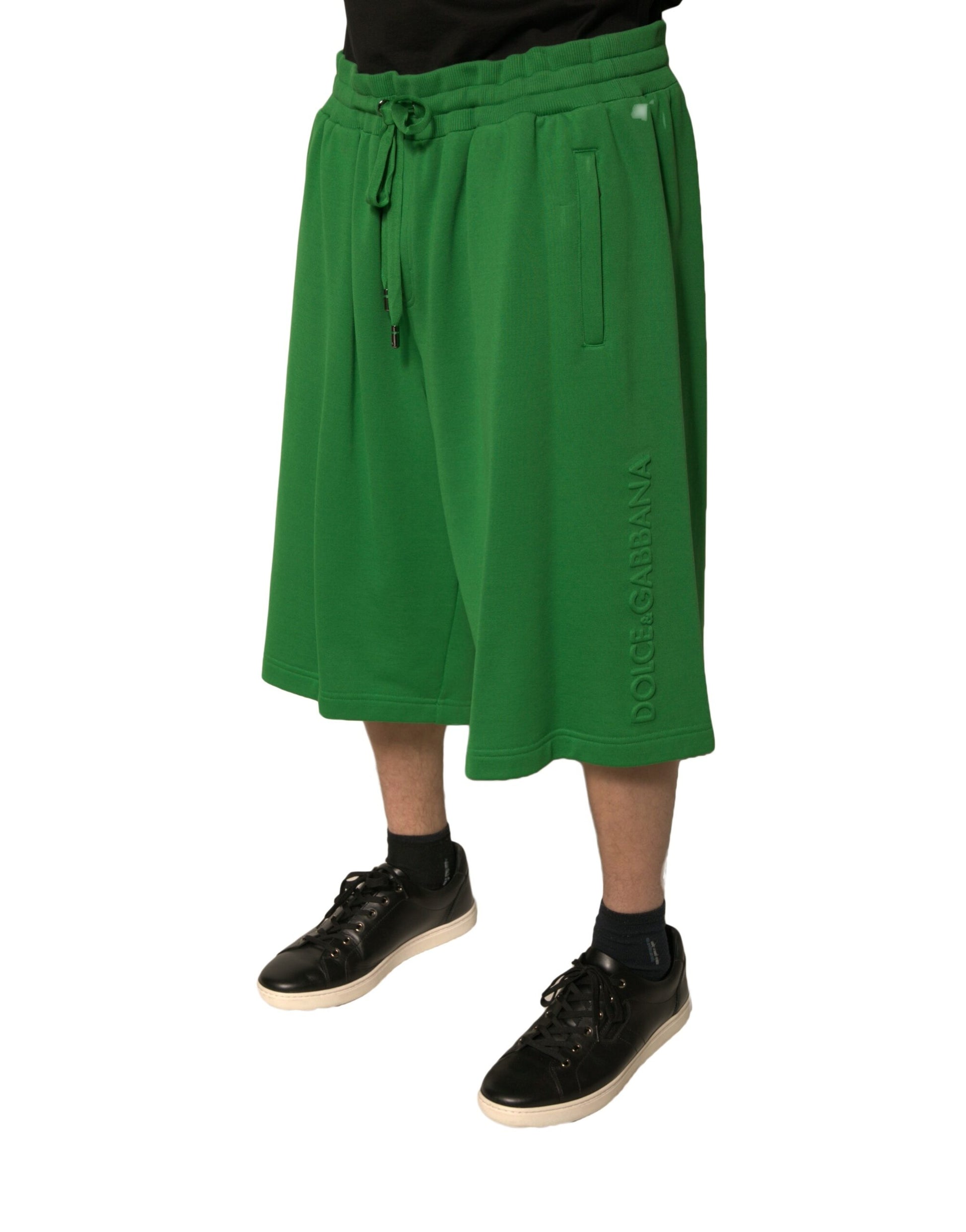 A pair of green cotton blend men's bermuda shorts from the brand Dolce & Gabbana