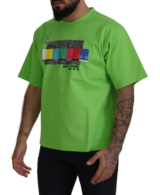 Man wearing green t-shirt with graphic design on front