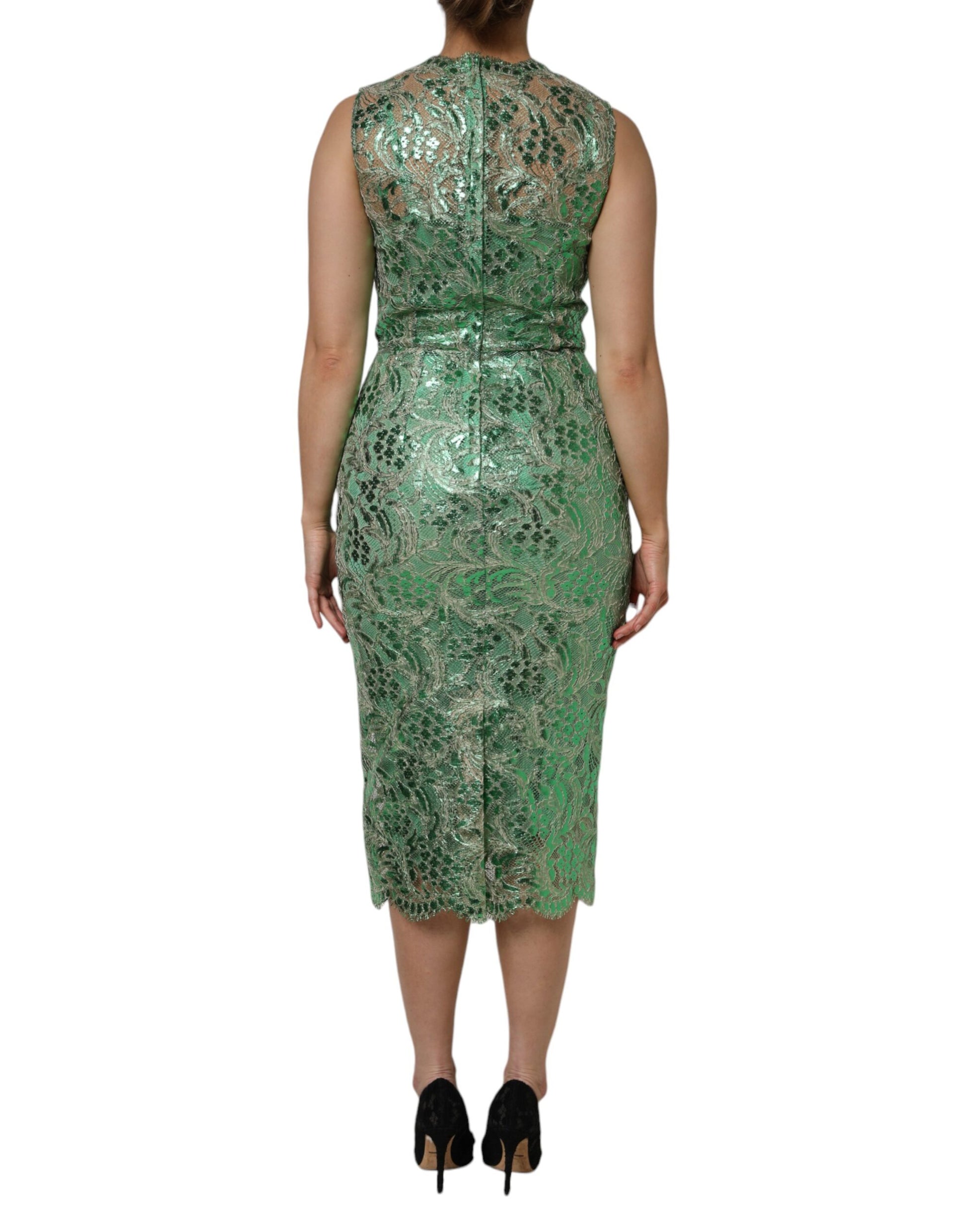 A green midi dress with floral lace detailing and a sheath silhouette