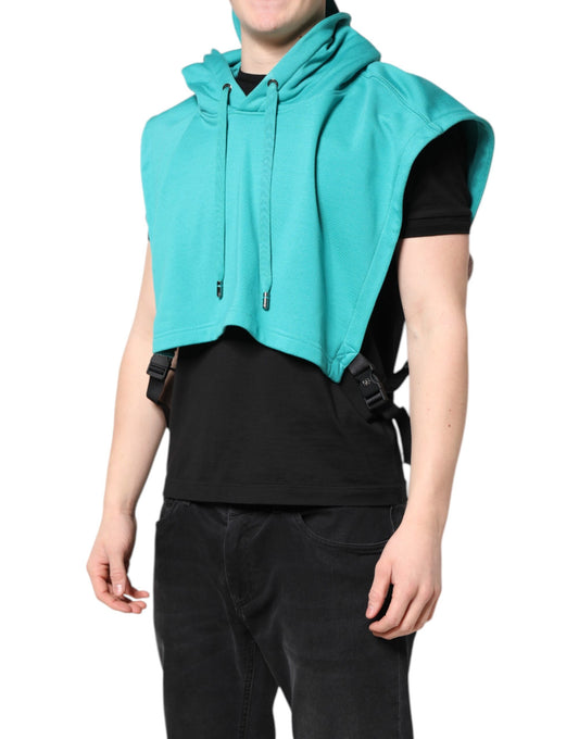 Man wearing a green hoodie vest over black shirt