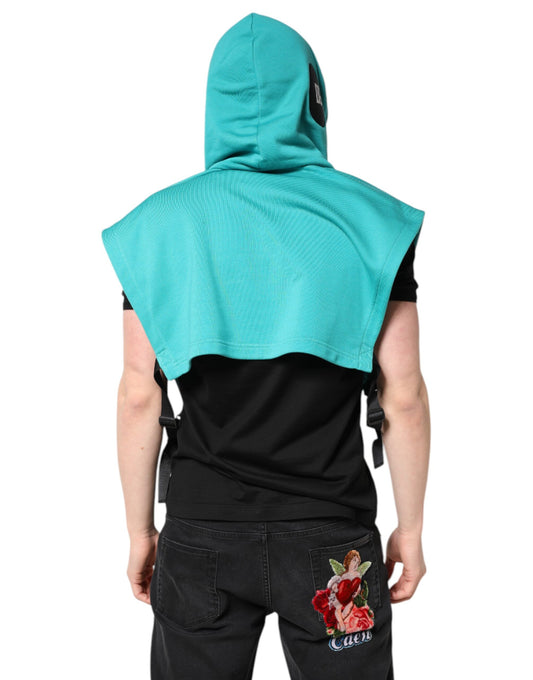Man wearing a hoodie with a blue towel draped over his shoulders