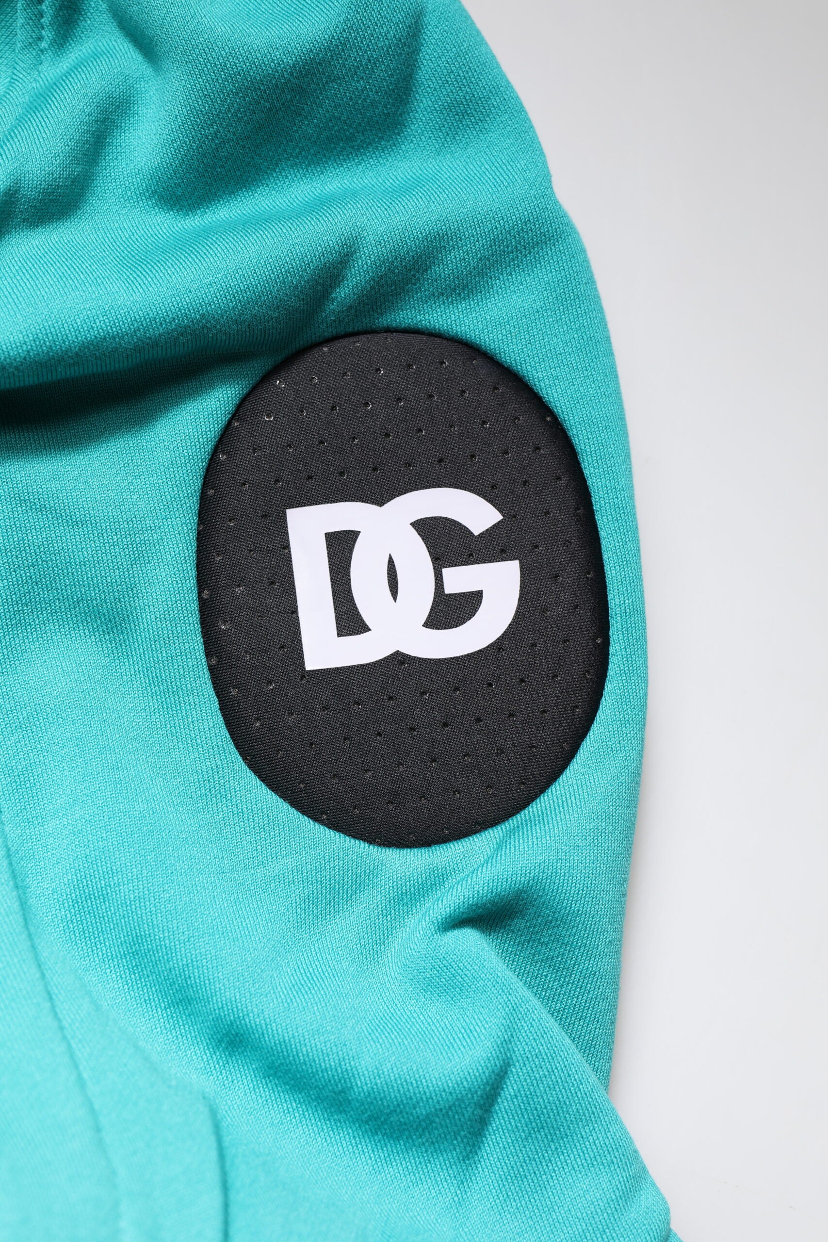 Green fabric with black logo