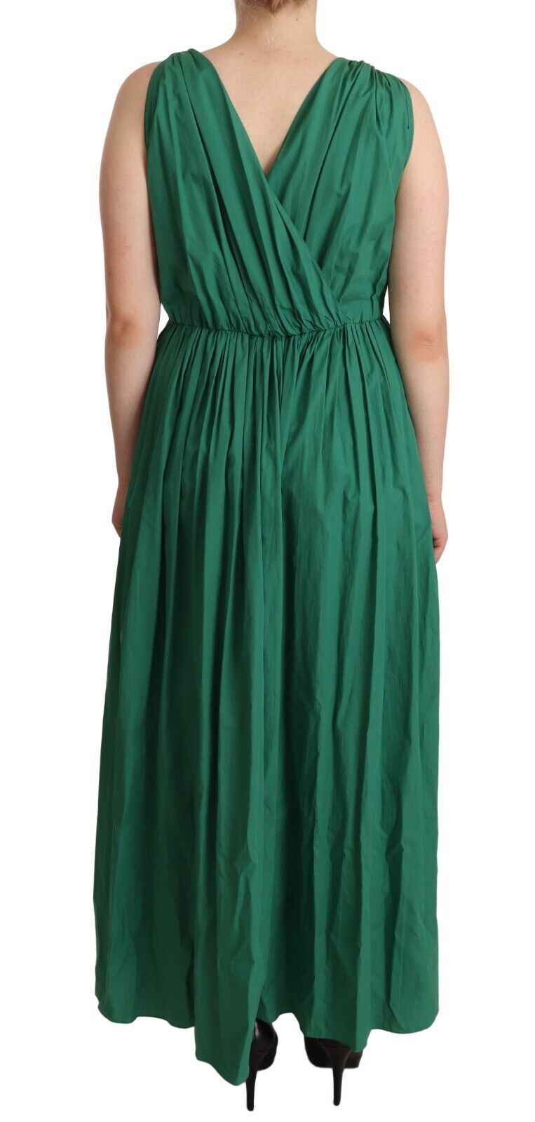 A green cotton sleeveless dress with a V-neckline and a flowing skirt