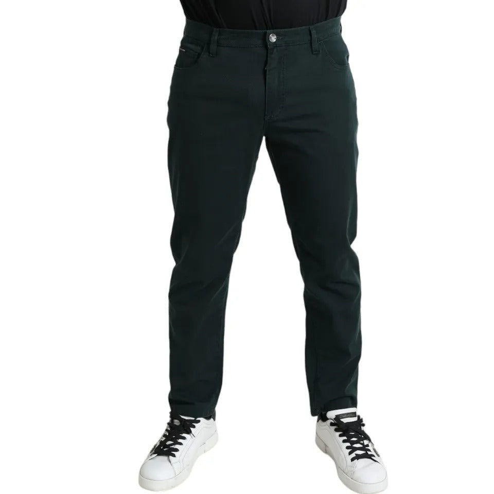 Pair of black pants on a person standing against white background