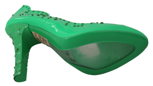 Green high heel shoe with bow on top and rhinestones around edge