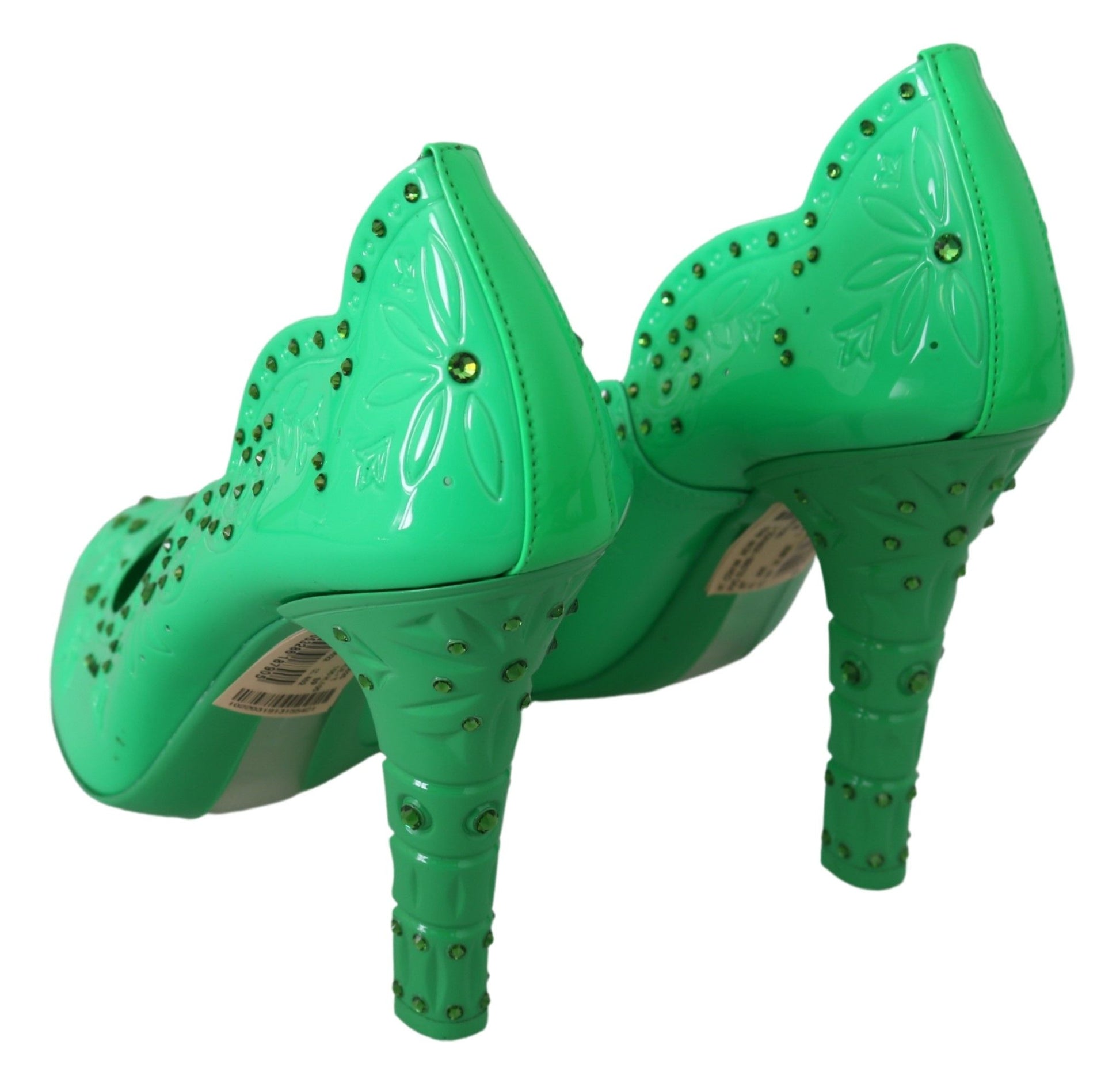 Green high heel shoes with embellishments and a bow design on top