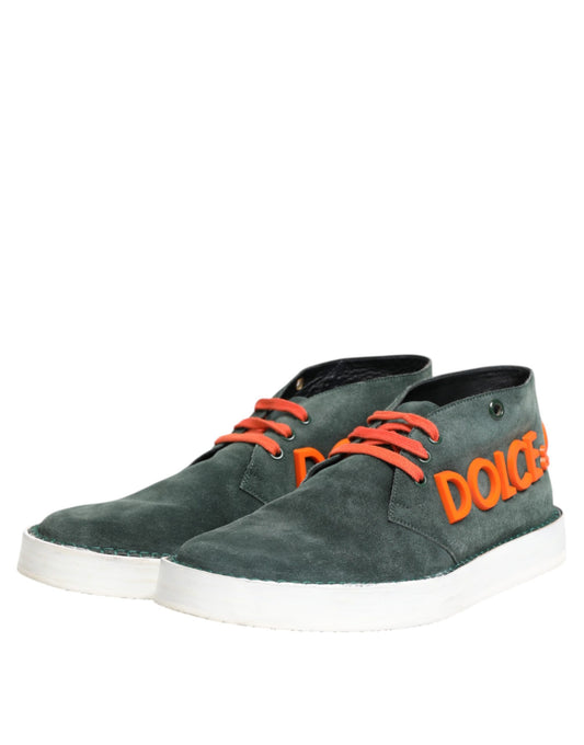 Pair of green suede shoes with red laces