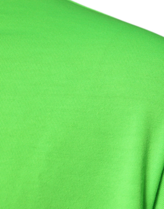 A green crew neck t-shirt with a logo on the front