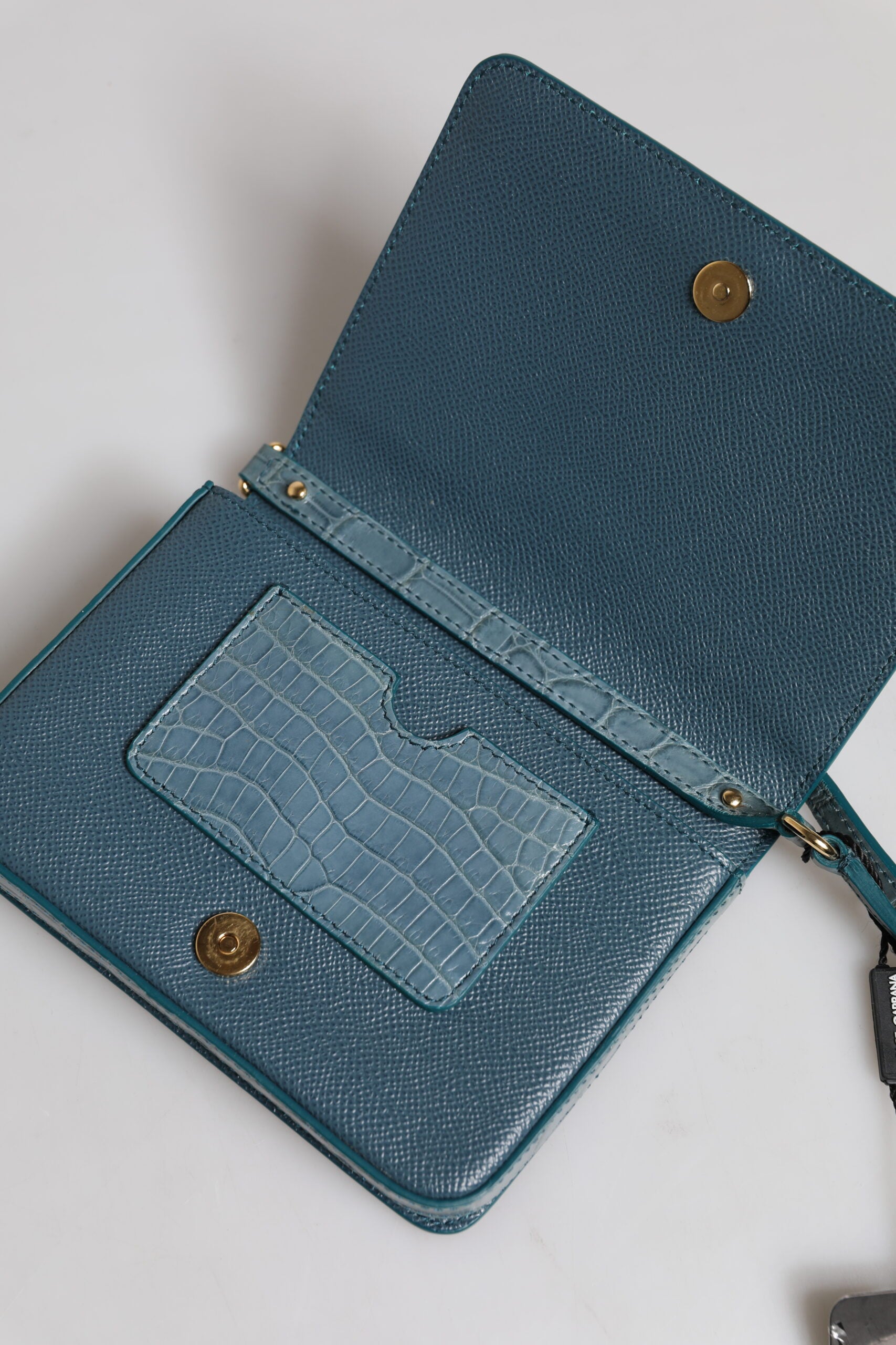 Blue leather wallet with gold accents
