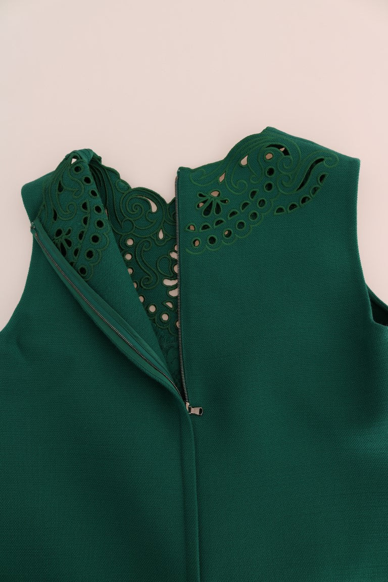 A green floral cutout silk wool dress with a zipper in the front