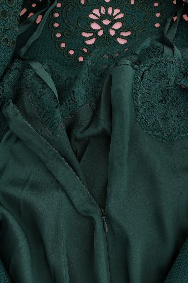 A green floral cutout silk wool dress with a lace-up front