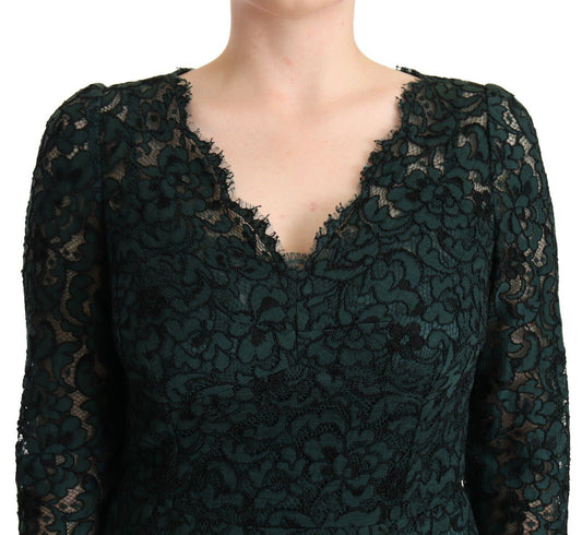 A green lace maxi dress with floral pattern and floor length sleeves
