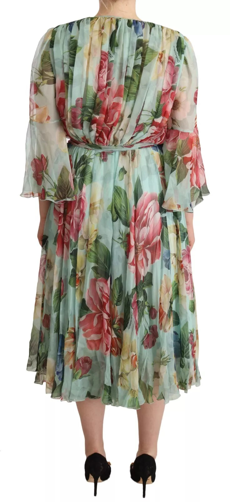 A long sleeved midi dress with a floral pattern and a V-neck