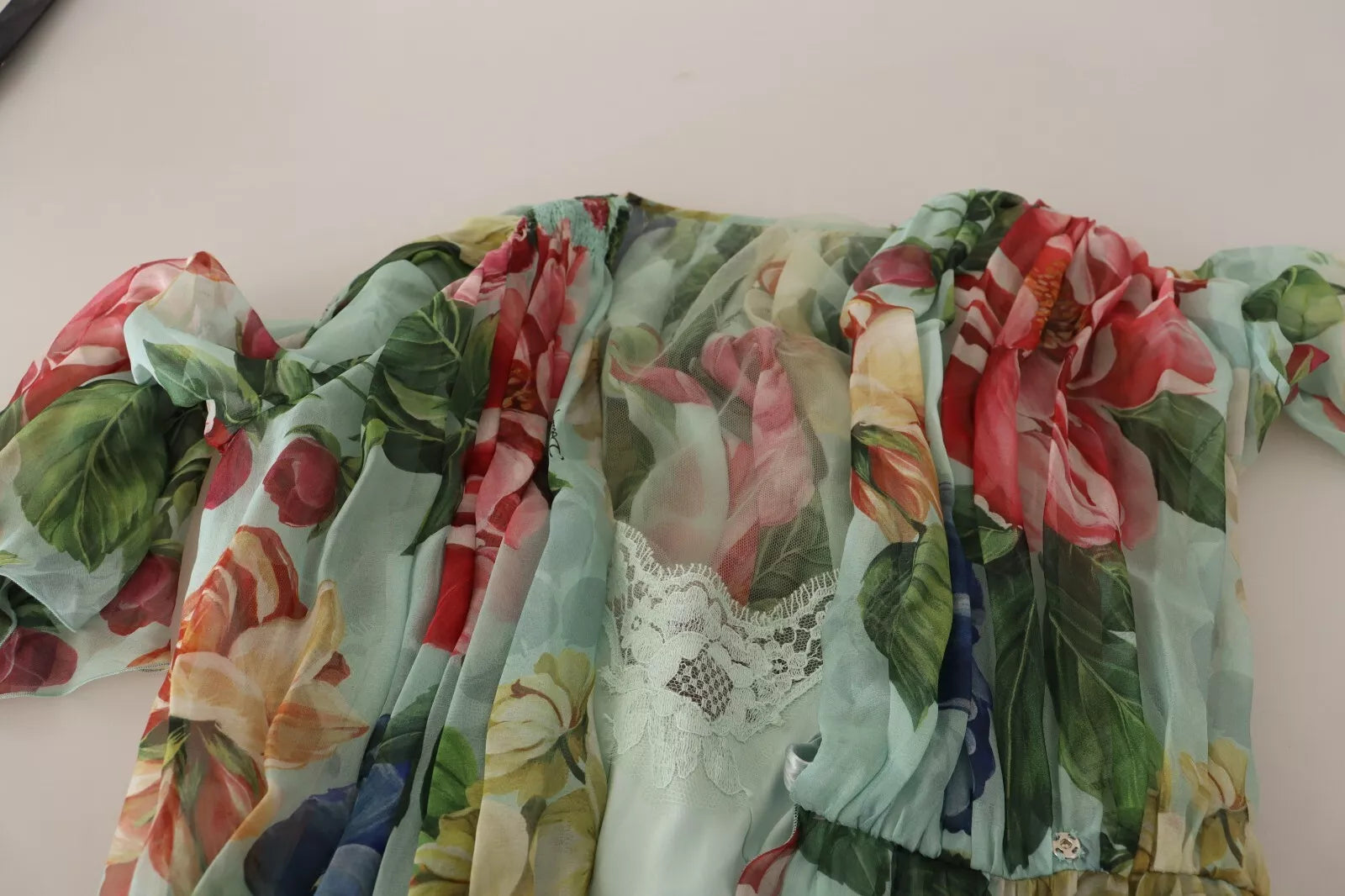 A green floral long sleeve midi dress with a V-neck