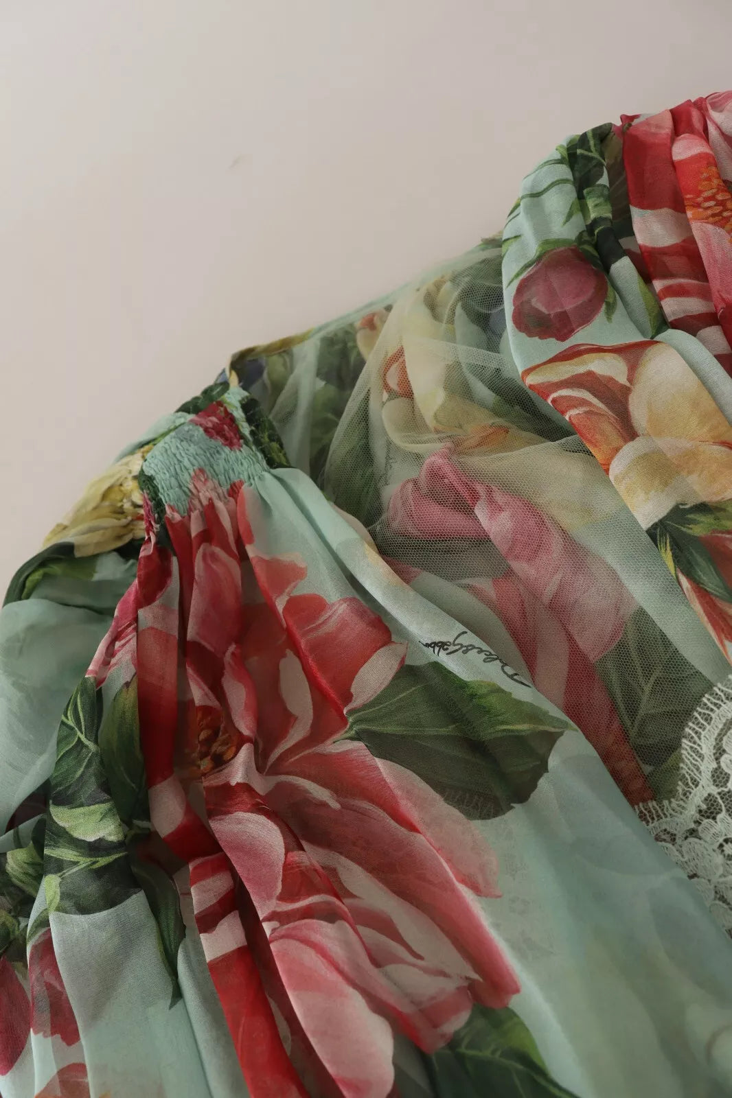 A green floral midi dress with long sleeves and a v-neck