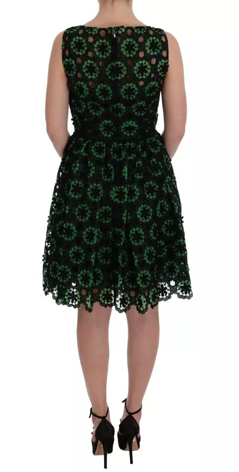 A green dress with floral ricamo detailing, designed by Dolce & Gabbana. It is an A-line shift dress with sho