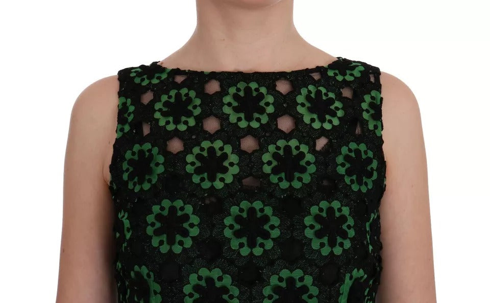 A green floral ricamo dress with a V-neckline and short sleeves. It features an A-line silhouette and is desi