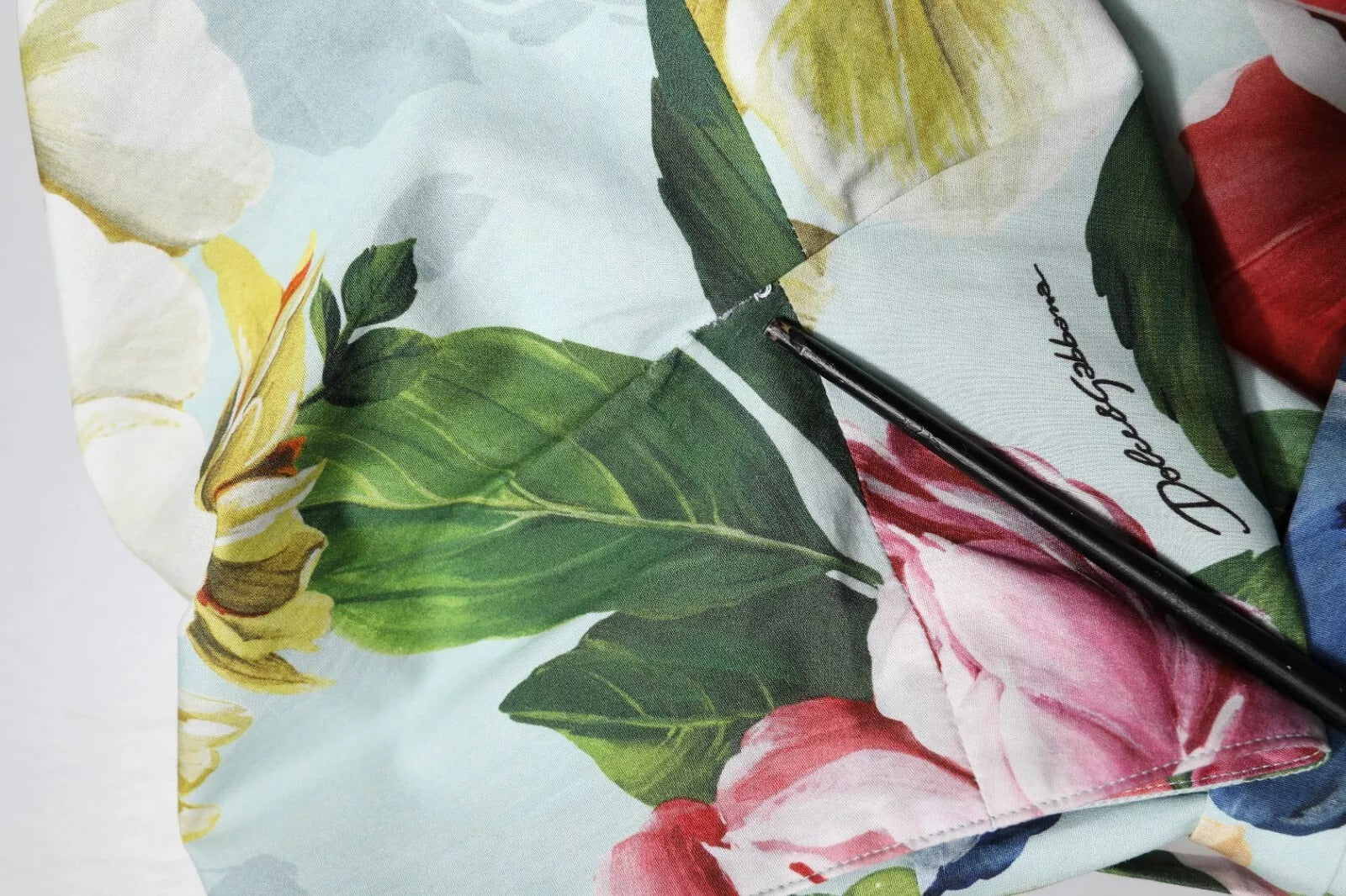 A green floral dress with short sleeves and a V-neck