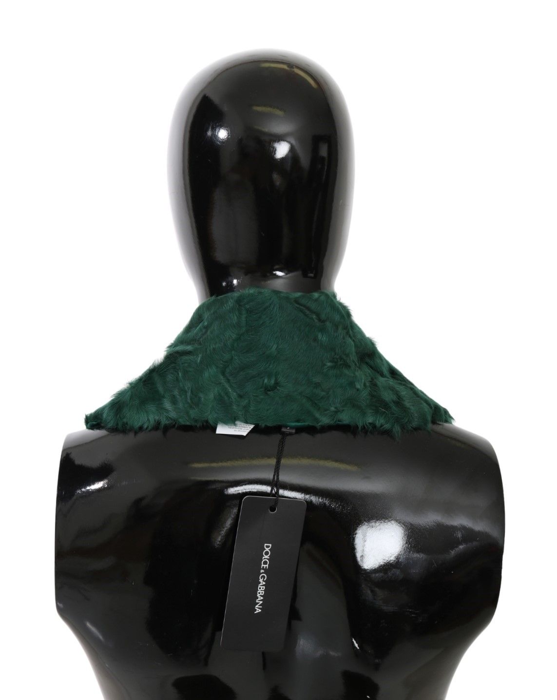 Mannequin torso with black shirt and green scarf