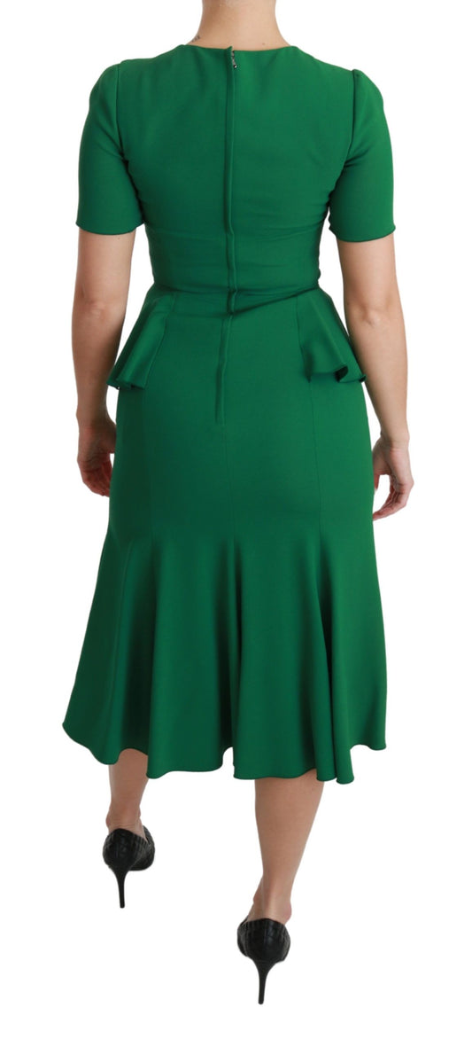 A green midi dress with heart patch detailing, designed by Dolce & Gabbana
