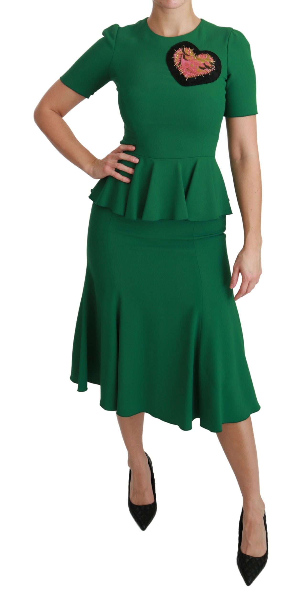 A green midi dress with a heart patch on the chest, designed by Dolce & Gabbana